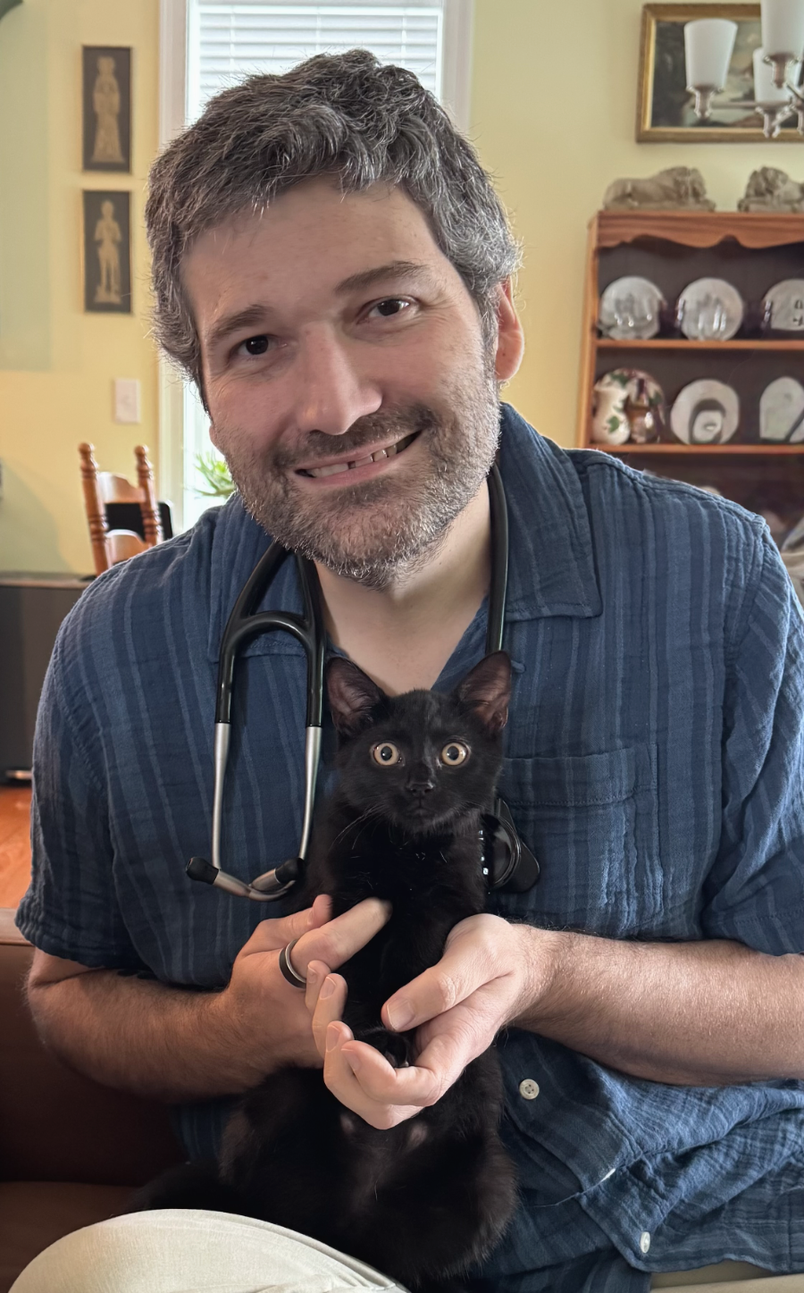 Adam Page, DVM, with a kitten